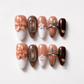 Elegant handmade mocha blossom medium almond nails with cat eye and 3D flower-Amber Atelier A007
